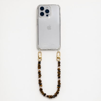 Brown and gold chip-bead Lagoon Stones SHORT PHONE STRAP attached to a clear phone case, shown as a flat lay.