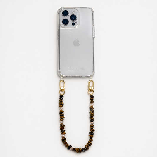 Brown and gold chip-bead Lagoon Stones SHORT PHONE STRAP attached to a clear phone case, shown as a flat lay.