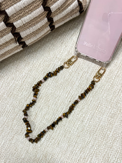 Close-up of a brown and gold chip-bead Lagoon Stones SHORT PHONE STRAP attached to a pink phone case.