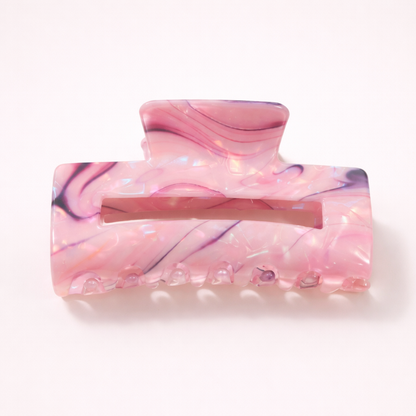 Lark HAIR CLIP large rectangular acetate claw clip in a pink marbled pattern with purple and navy streaks, studio shot.