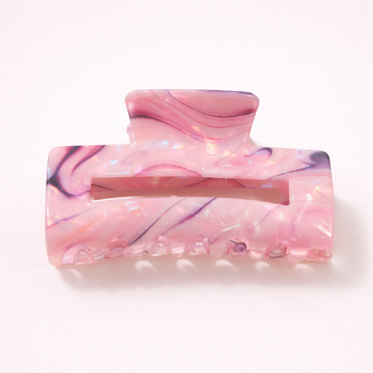 Lark HAIR CLIP large rectangular acetate claw clip in a pink marbled pattern with purple and navy streaks, studio shot.