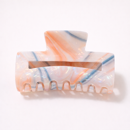 Lark HAIR CLIP large rectangular acetate claw clip in white with orange and blue streaks, studio shot.
