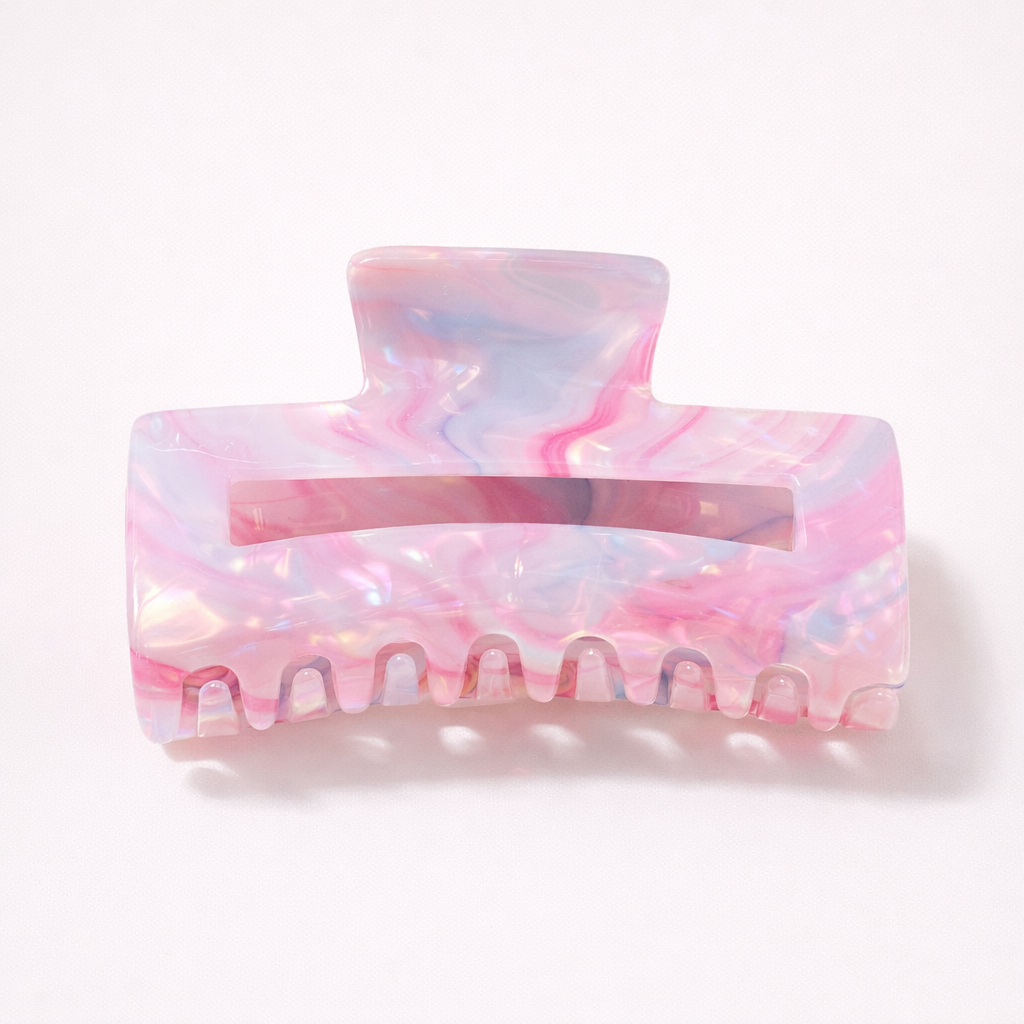 Lark HAIR CLIP large rectangular acetate claw clip in a pink, blue and white marbled pattern, studio shot.
