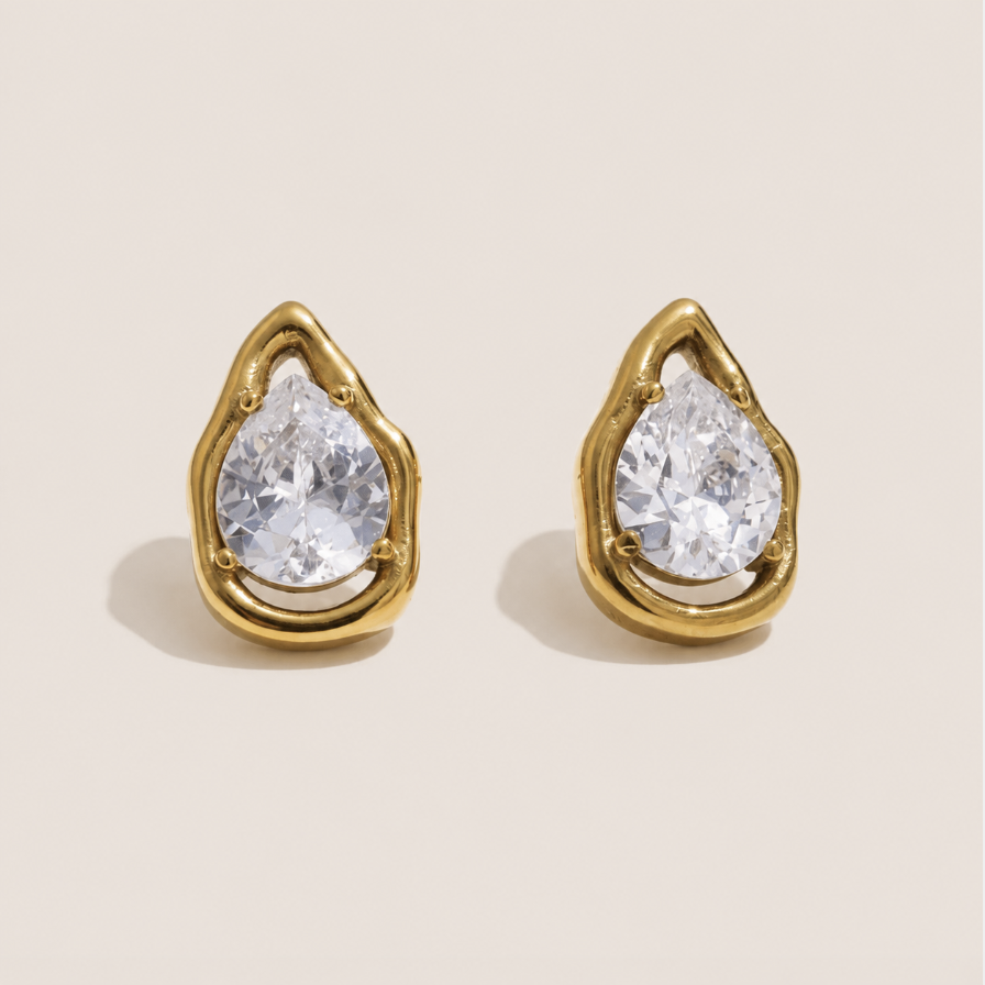Gold teardrop stud earrings with a pear-cut white zirconia stone in an open molten-frame setting — Folie à Trois Larme EARRINGS