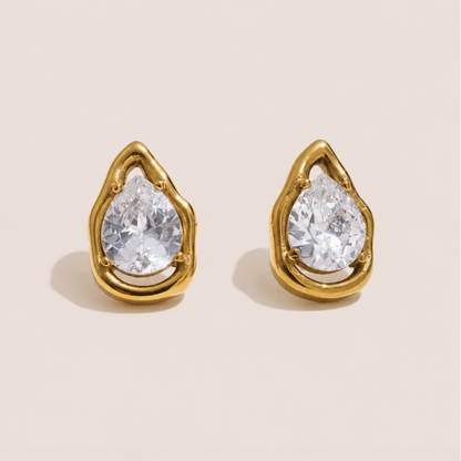 Gold teardrop stud earrings with a pear-cut white zirconia stone in an open molten-frame setting — Folie à Trois Larme EARRINGS