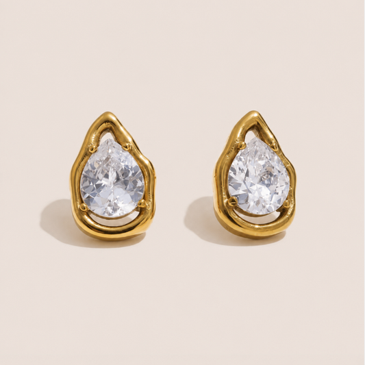 Gold teardrop stud earrings with a pear-cut white zirconia stone in an open molten-frame setting — Folie à Trois Larme EARRINGS