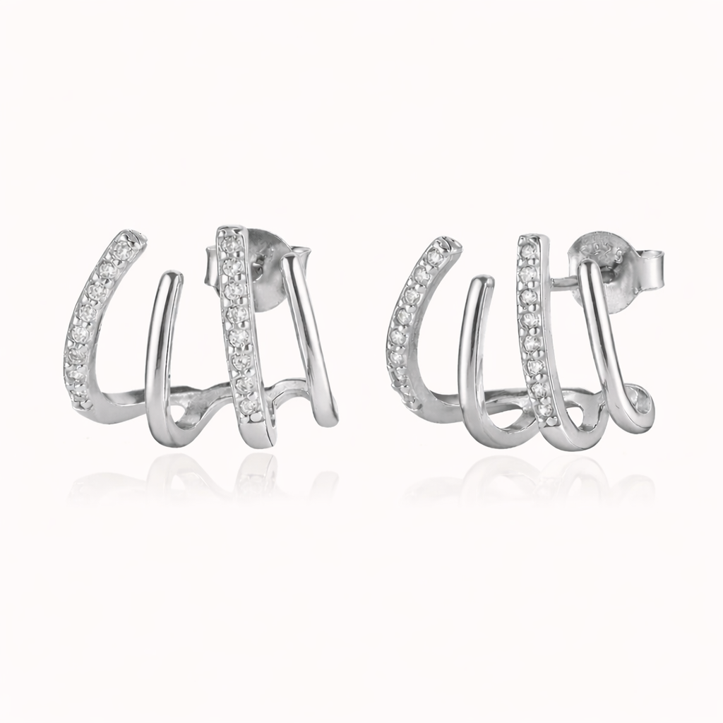 The Lennon EARRINGS are shown in silver, with three curved bands, one lined in sparkling round crystals.