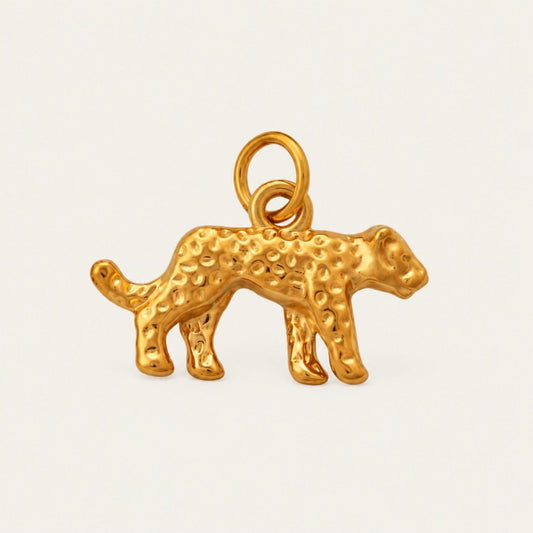The Leopard CHARM in gold, a leopard-shaped pendant with textured spots, shown in close-up product photography.
