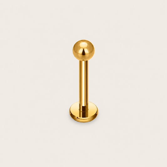 The Little Ball PIERCING is a gold labret stud with a small polished ball top and a flat internal back disc.