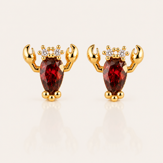 Gold Little Lobster EARRINGS stud with a red pear-cut cubic zirconia body, two curved claws, and three small white round accent stones.
