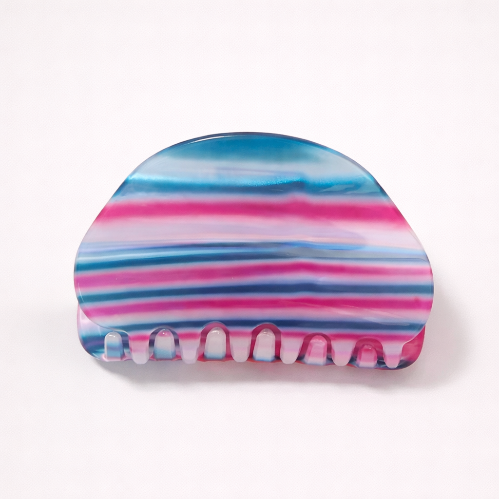 Livvy HAIR CLIP dome-shaped acetate claw clip in horizontal blue, pink and navy striped pattern, studio shot.