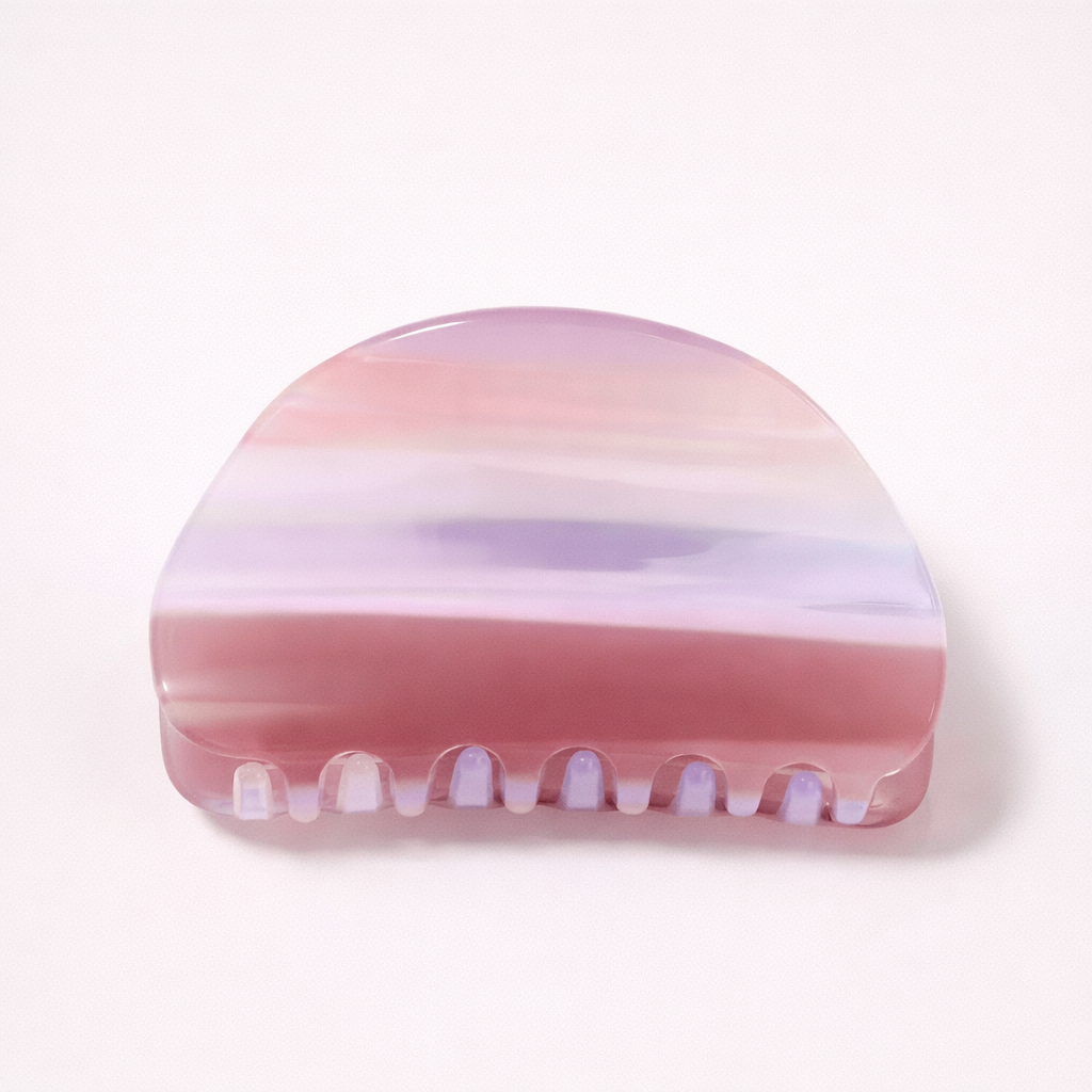 Livvy HAIR CLIP dome-shaped acetate claw clip in horizontal mauve, lilac and pink striped pattern, studio shot.