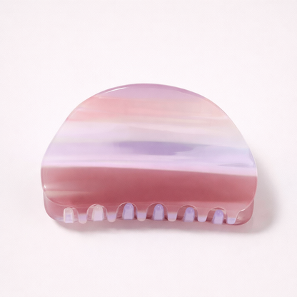 Livvy HAIR CLIP dome-shaped acetate claw clip in horizontal mauve, lilac and pink striped pattern, studio shot.