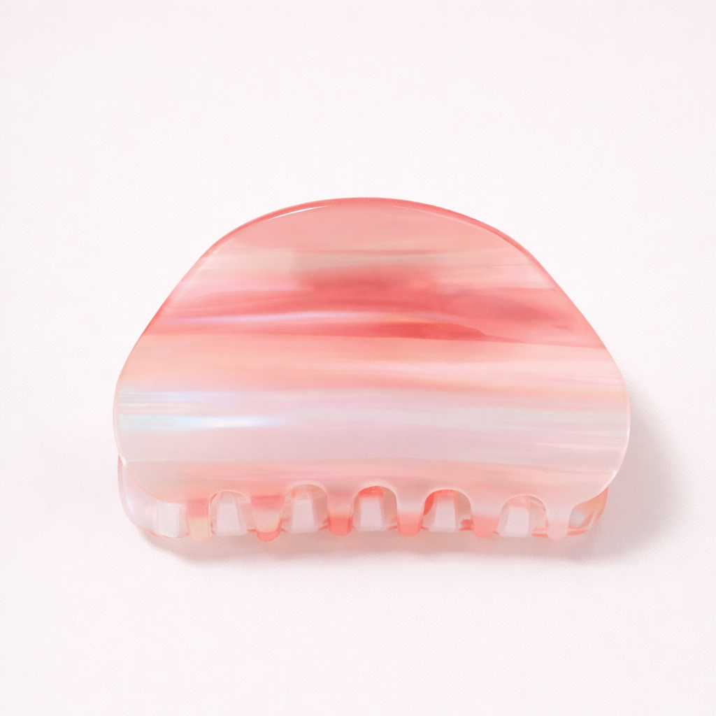 Livvy HAIR CLIP dome-shaped acetate claw clip in horizontal coral, pink and white striped pattern, studio shot.