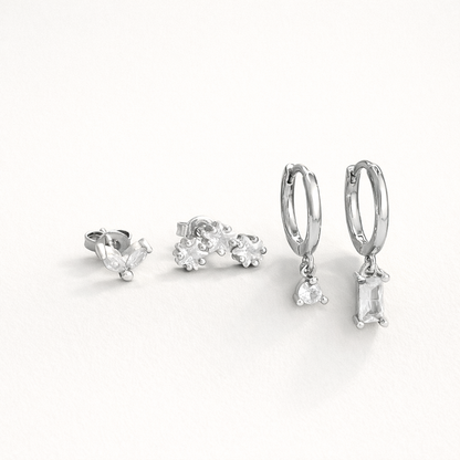 Lola Set in silver tone, showing the same marquise stud, flower-cluster stud, and crystal-drop hoop pair.