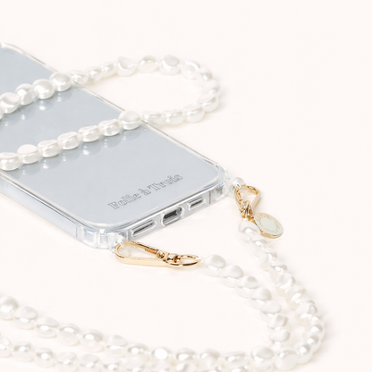 Close-up of a phone case attached to a baroque pearl strand with gold-tone clasps, chunkier than the usual round Long Pearl beads.