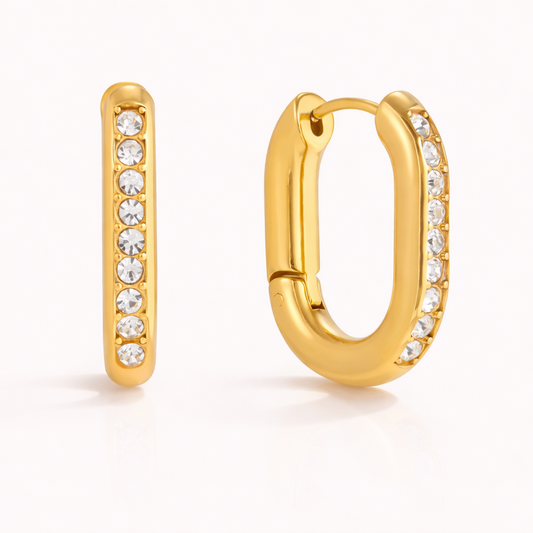 The Love Bite EARRINGS are chunky gold rectangular hoops fully lined with sparkling round white crystals.