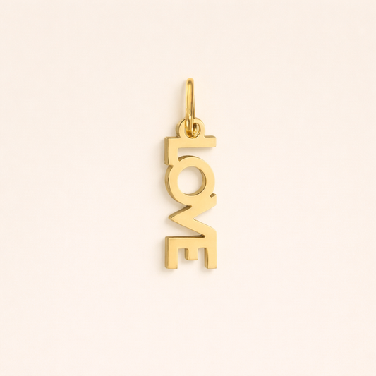 The Love CHARM in polished gold, its vertical LOVE lettering shown alone on a plain studio background.