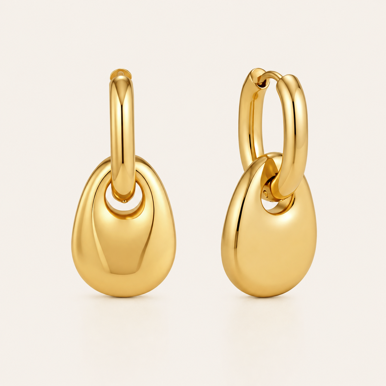 Gold chunky pebble-drop hoop earring with a glossy rounded teardrop dangling from a plain hoop — Folie à Trois Lucent EARRINGS.
