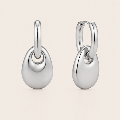 Silver chunky pebble-drop hoop earring with a glossy rounded teardrop dangling from a plain hoop — Folie à Trois Lucent EARRINGS.