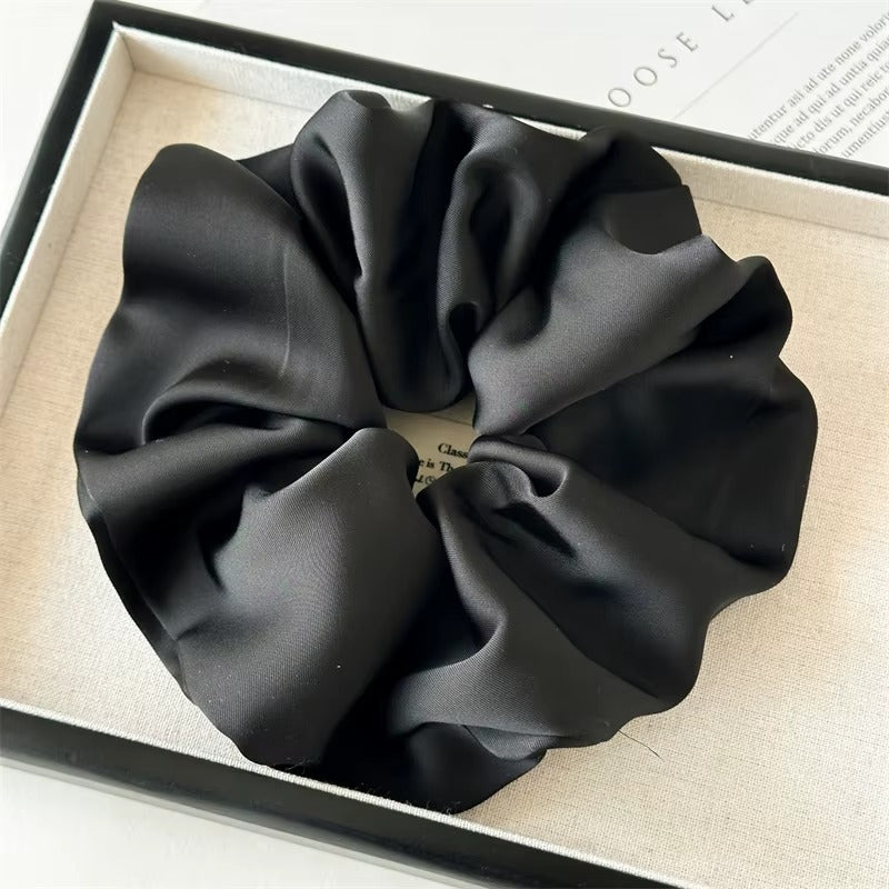 Lucia SCRUNCHIE XL oversized satin scrunchie in black, shown in a black gift box.