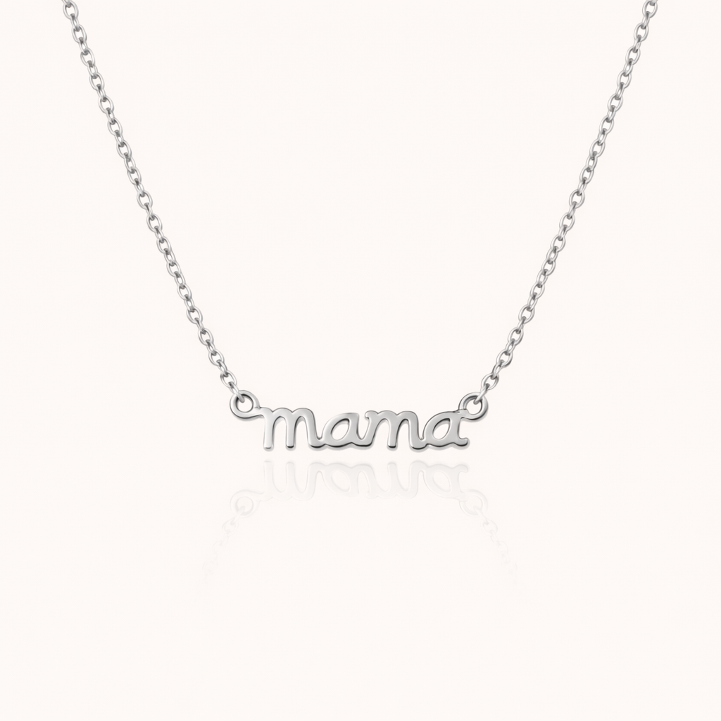 The Mama Small NECKLACE in silver, a delicate script mama pendant on a fine chain, shown flat on a cream background.