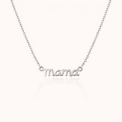 The Mama Small NECKLACE in silver, a delicate script mama pendant on a fine chain, shown flat on a cream background.