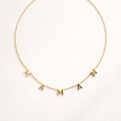 The Maman NECKLACE in gold, individual letters spelling MAMAN dangling from a fine chain, shown flat.