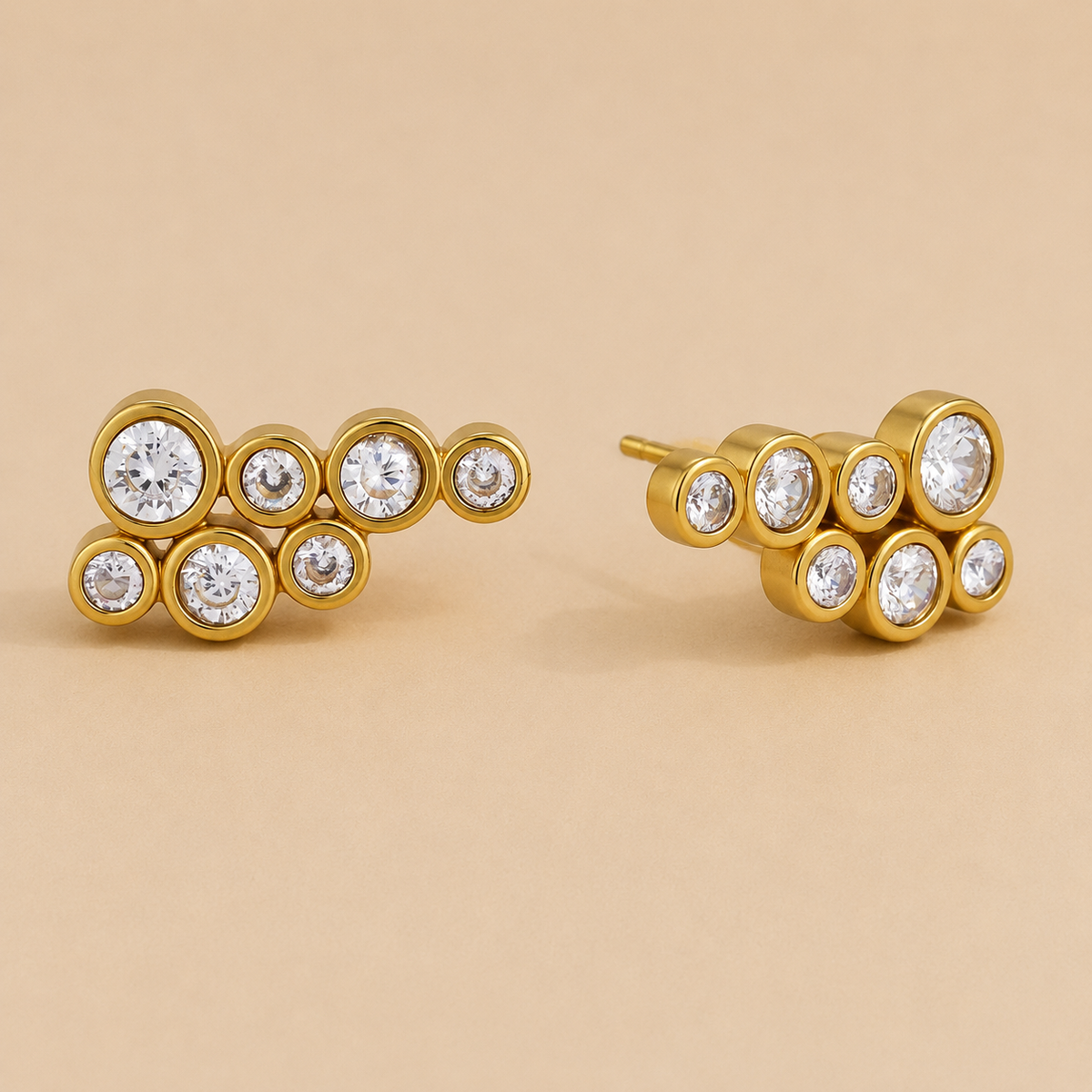 Gold cluster stud earring with seven round bezel-set white zirconia stones in a bubble-like arrangement — Folie à Trois Mar EARRINGS.