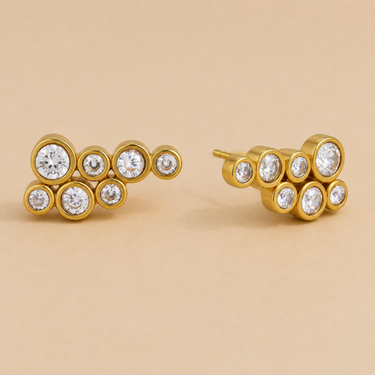 Gold cluster stud earring with seven round bezel-set white zirconia stones in a bubble-like arrangement — Folie à Trois Mar EARRINGS.