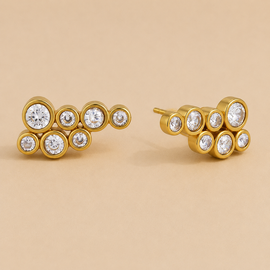 Gold cluster stud earring with seven round bezel-set white zirconia stones in a bubble-like arrangement — Folie à Trois Mar EARRINGS.