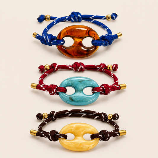 Marée BRACELET set shown in three colorways: amber on blue cord, turquoise on red cord, and butter yellow on brown cord.