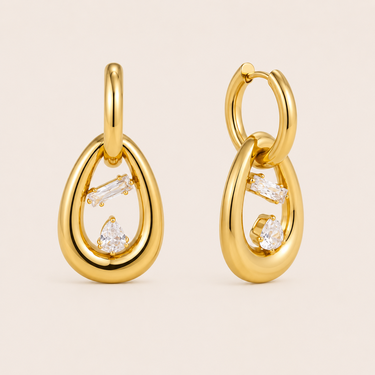 Gold rounded oval link drop earring with a horizontal baguette-cut white zirconia stone bezel-set at the center — Folie à Trois Marnie EARRINGS.