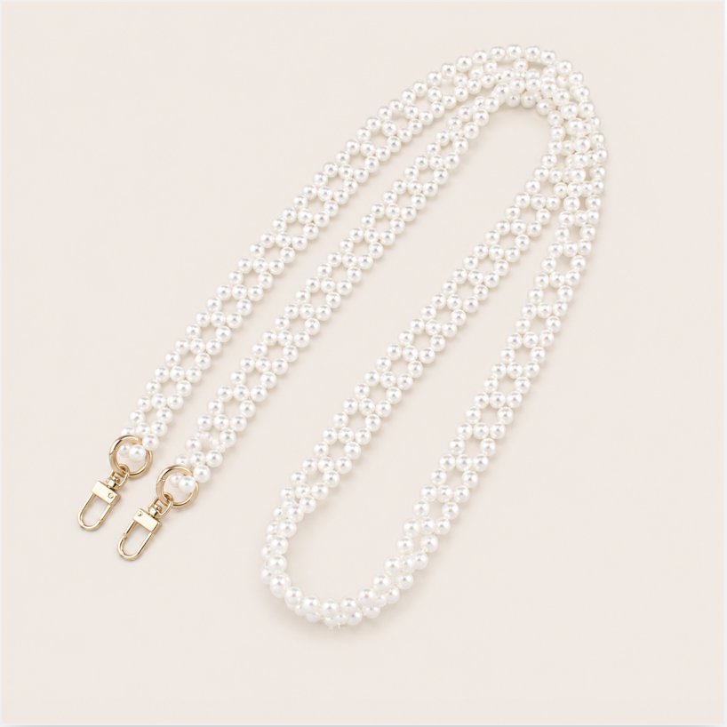 Marnie Pearl Long Phone Chain - woven pearl chain, luxury packshot on beige background
