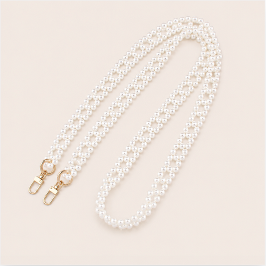Marnie Pearl Long Phone Chain - woven pearl chain, luxury packshot on beige background