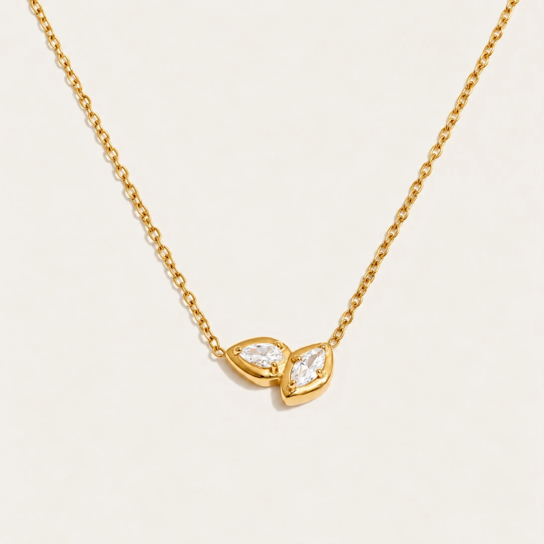 Gold Marquise NECKLACE: a fine chain with a small double-marquise pendant framing a white zirconia — Folie à Trois