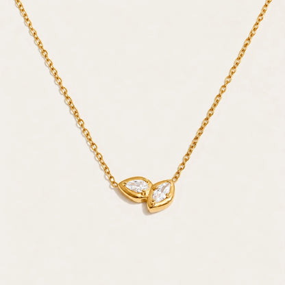 Gold Marquise NECKLACE: a fine chain with a small double-marquise pendant framing a white zirconia — Folie à Trois