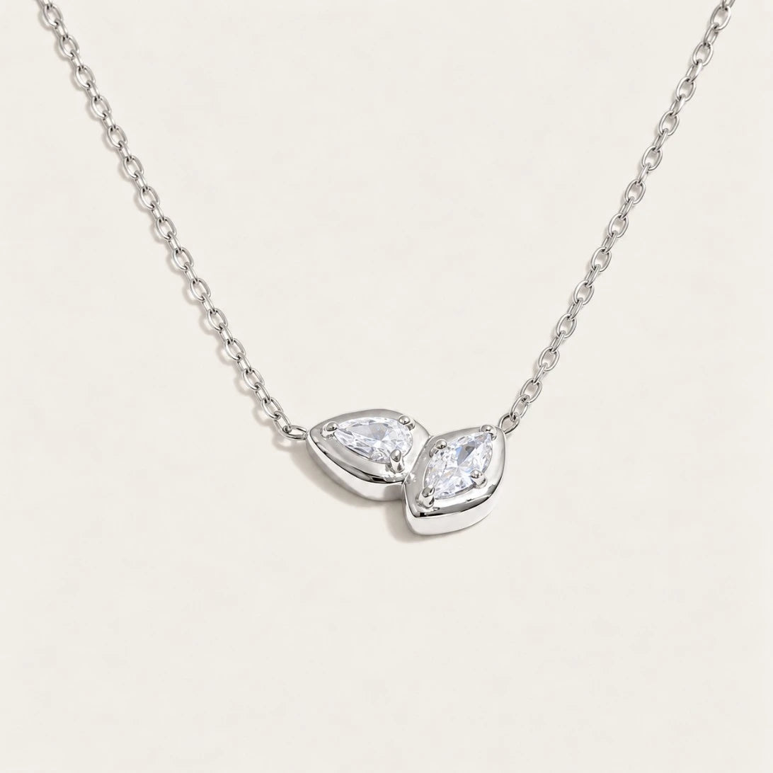 Silver-tone Marquise NECKLACE: a fine chain with a small double-marquise pendant framing a white zirconia — Folie à Trois