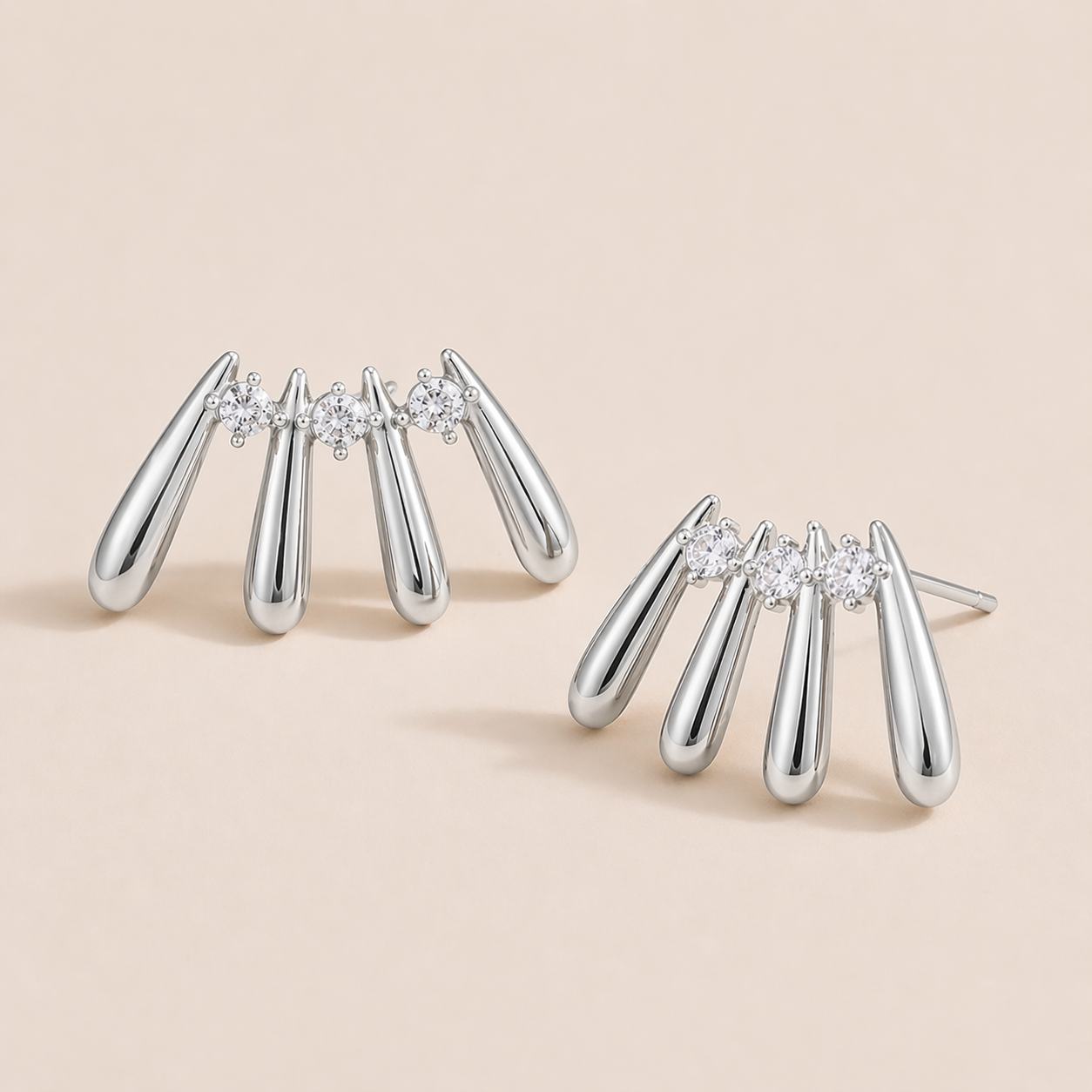 Silver Martina EARRINGS studs with four fanned teardrop bars and three round cubic zirconia stones set between them.