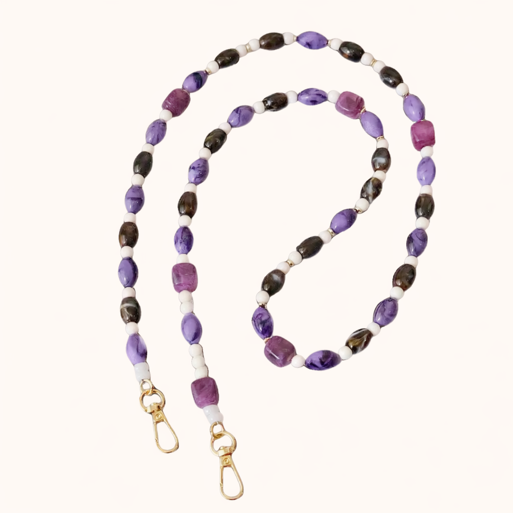 Purple and brown beaded Meryn long phone chain coiled flat with gold-tone clasp ends.