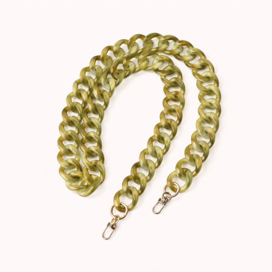 A coiled olive green marbled acrylic curb-link phone chain with gold clasps, shown on a cream background.