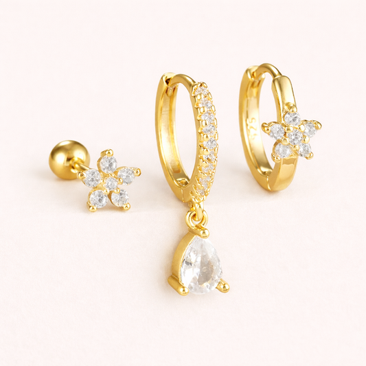 The Mica SET includes three gold pieces: a flower stud, a pave hoop with teardrop drop, and a flower huggie.