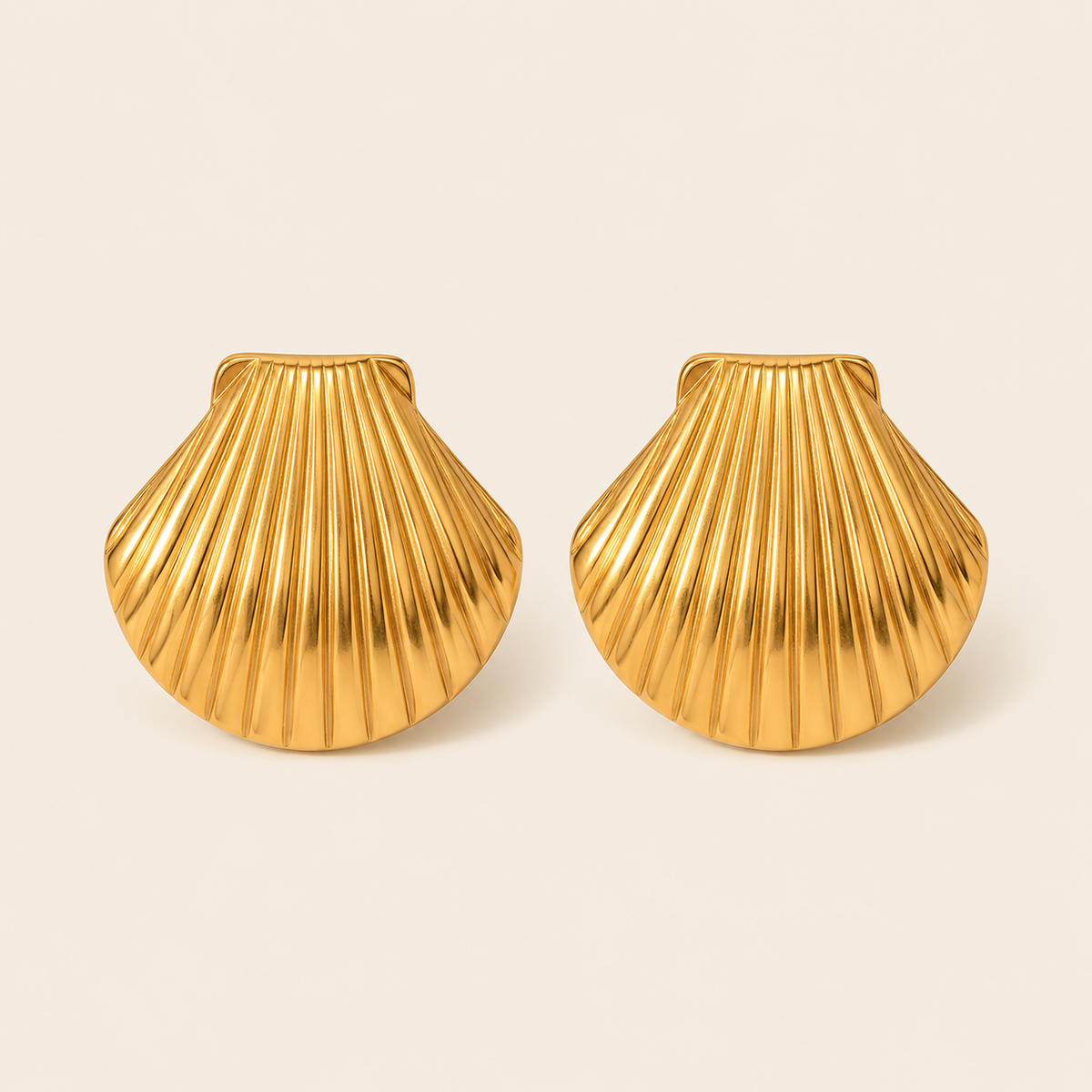 Gold ribbed scallop shell-shaped stud earring with a fanned fluted texture — Folie à Trois Midday Sun EARRINGS.