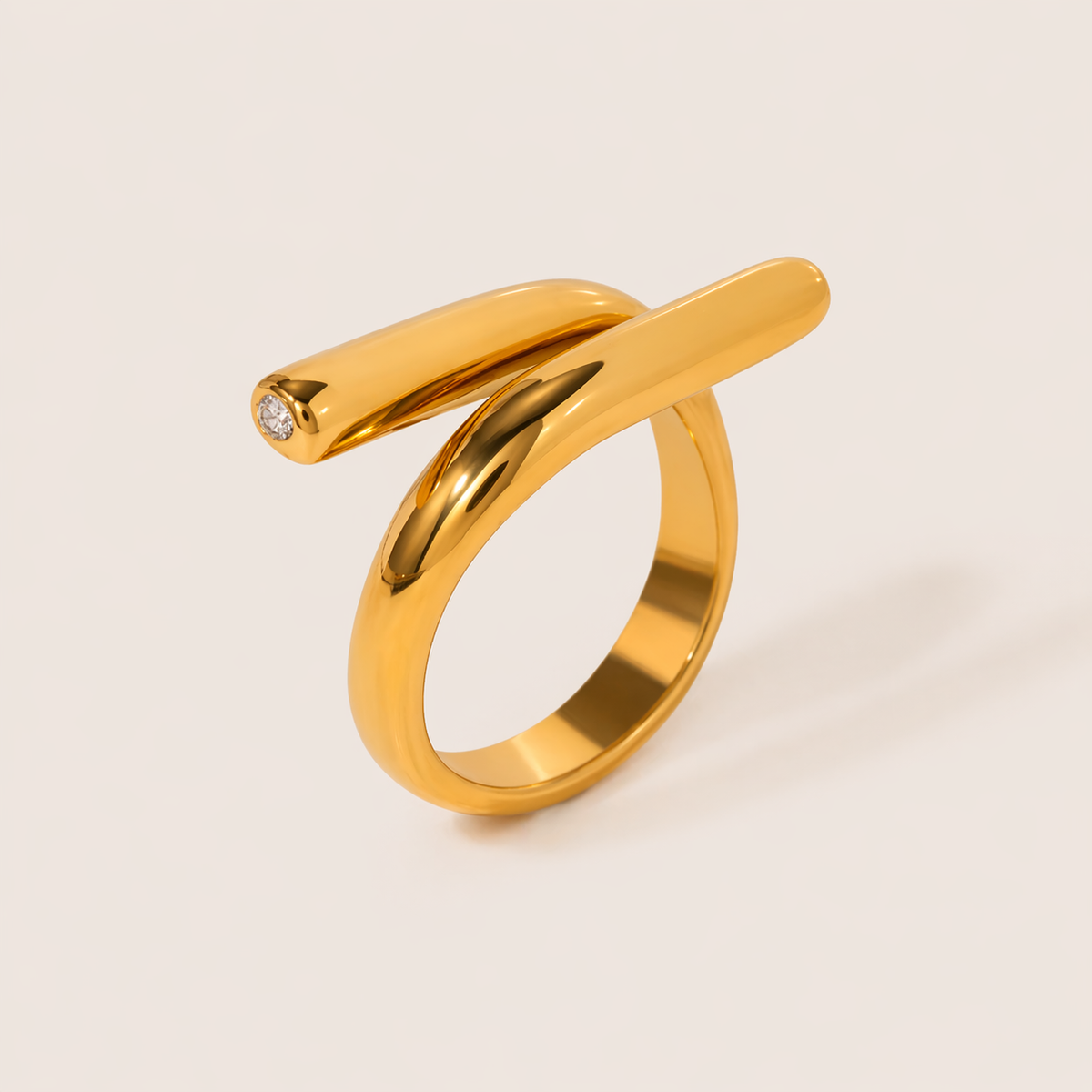 Gold ring with two parallel bars crossing an open band, one tipped with a small white zirconia stone — Folie à Trois Mischa RING.
