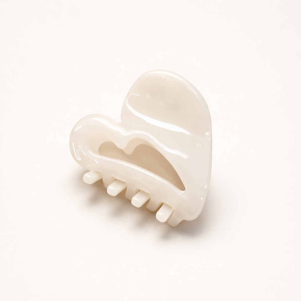Mon Cœur HAIR CLIP heart-shaped acetate claw clip in a solid cream shade, studio shot.
