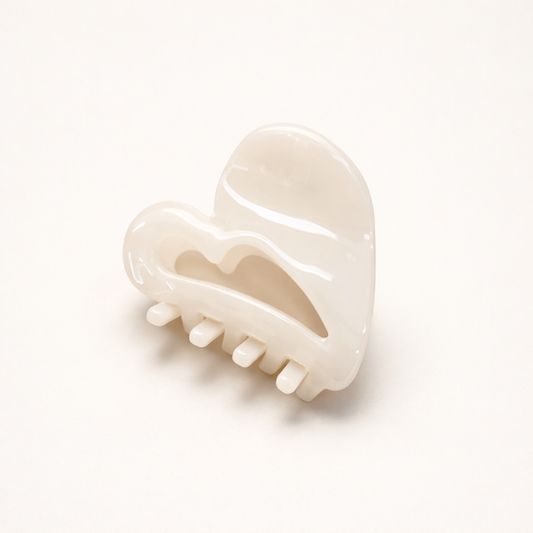Mon Cœur HAIR CLIP heart-shaped acetate claw clip in a solid cream shade, studio shot.