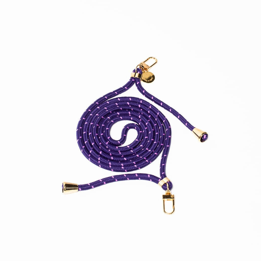 Purple Multi Colorful PHONE CORD with a scattered white dot pattern, coiled with gold-tone hardware on white.