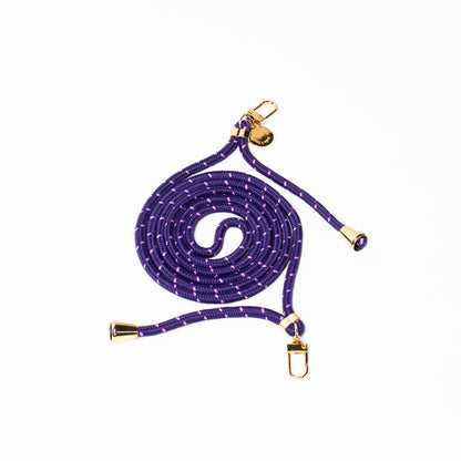 Purple Multi Colorful PHONE CORD with a scattered white dot pattern, coiled with gold-tone hardware on white.