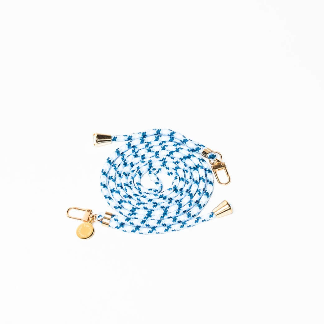 Blue and white patterned Multi Colorful PHONE CORD coiled with gold-tone hardware on a white background.