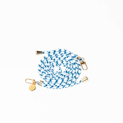 Blue and white patterned Multi Colorful PHONE CORD coiled with gold-tone hardware on a white background.